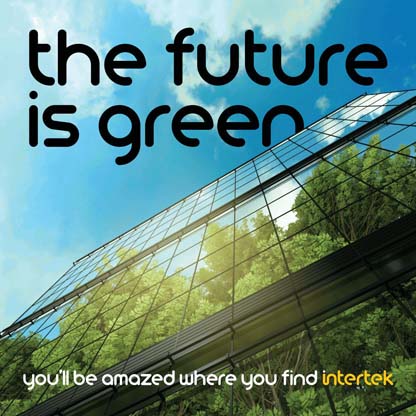 Lush vegetation reflected in the glass windows of a commercial building